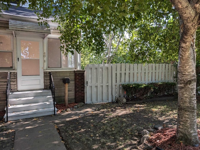 exterior space with entry steps and fence