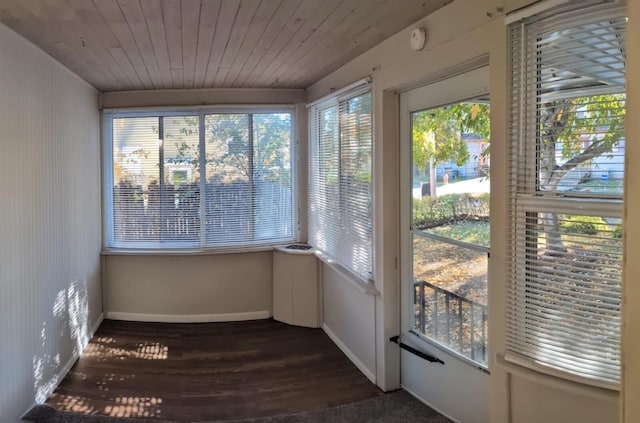 unfurnished sunroom with wooden ceiling