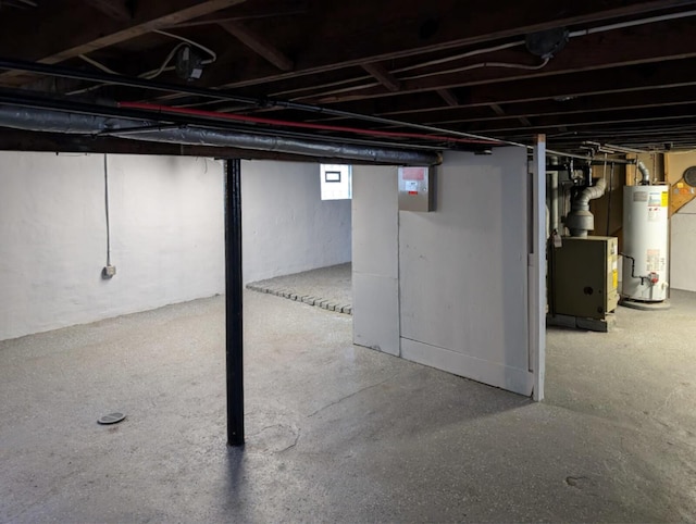 below grade area featuring gas water heater and a heating unit