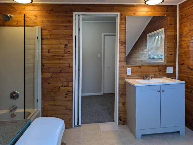 full bath with shower / bath combination, wooden walls, toilet, and vanity