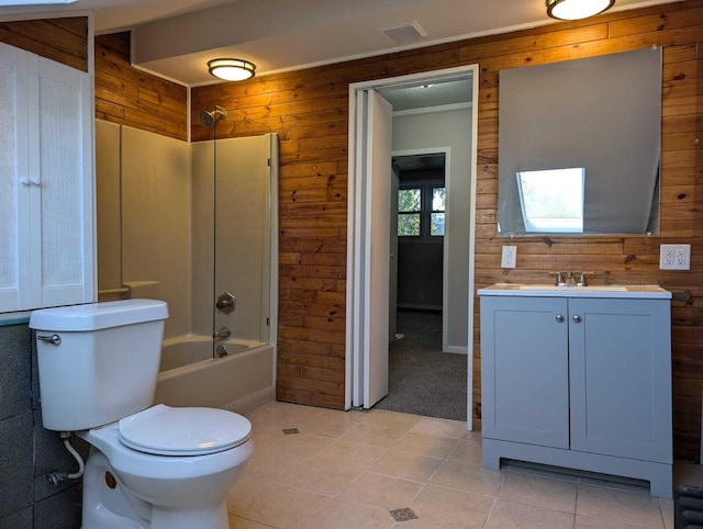 bathroom with visible vents, toilet, tub / shower combination, wood walls, and vanity