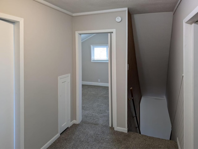 corridor featuring carpet and baseboards