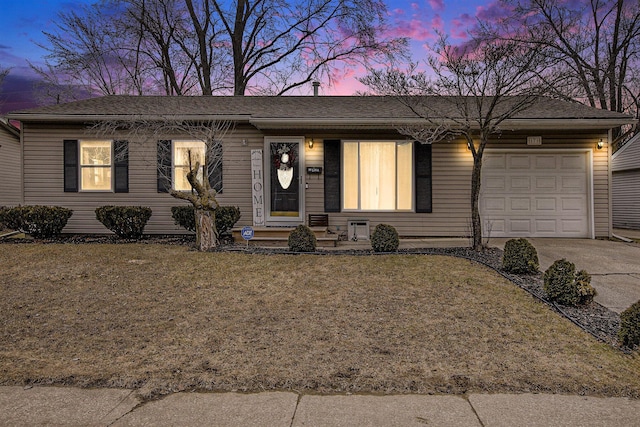 single story home featuring concrete driveway, a yard, and an attached garage