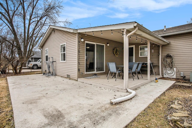 back of house with a patio