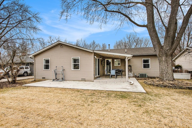 back of house featuring a patio, a yard, crawl space, and cooling unit