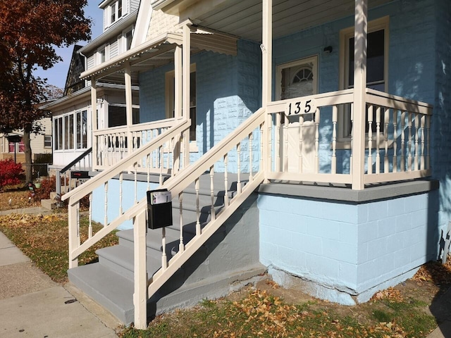 doorway to property with covered porch