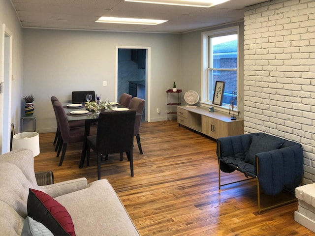 dining space with light wood-style floors and baseboards