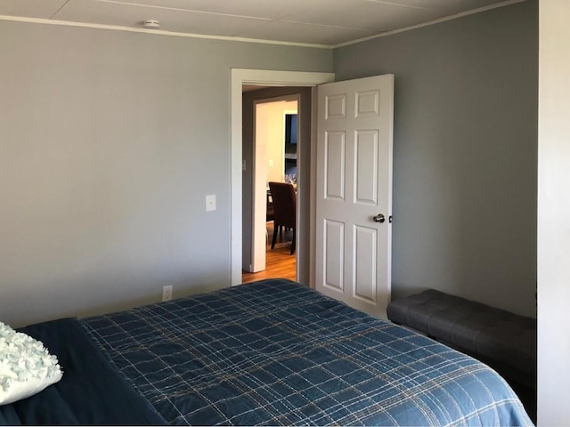 bedroom with crown molding