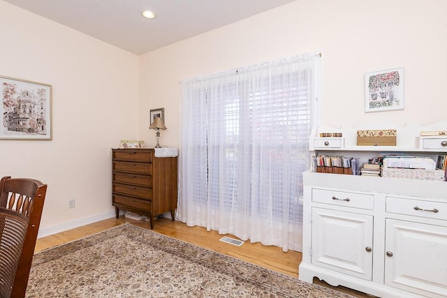 office area featuring recessed lighting, baseboards, visible vents, and light wood finished floors