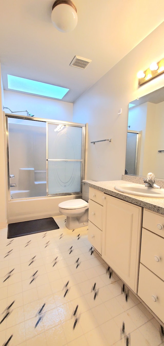 full bath with enclosed tub / shower combo, visible vents, toilet, and vanity