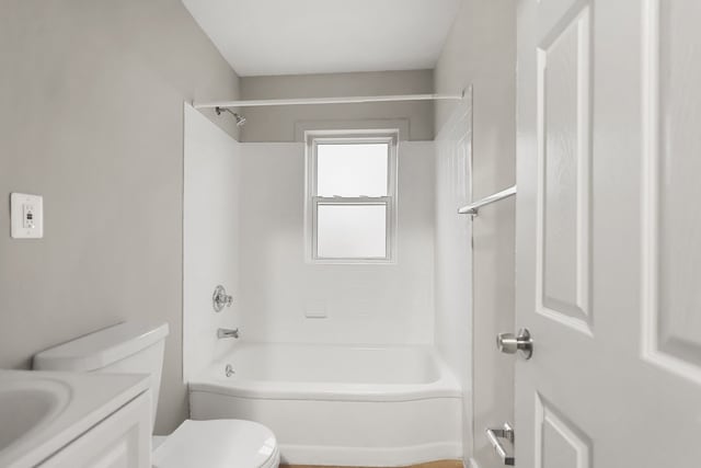 bathroom featuring shower / bathtub combination, vanity, and toilet