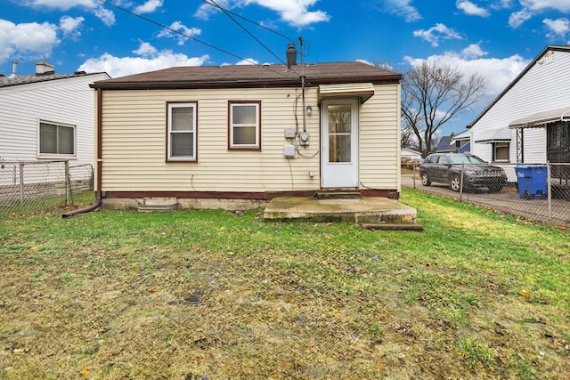 back of house with a yard, a patio area, and fence