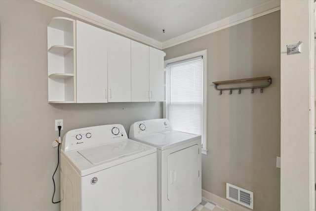 laundry area with separate washer and dryer, visible vents, baseboards, ornamental molding, and cabinet space