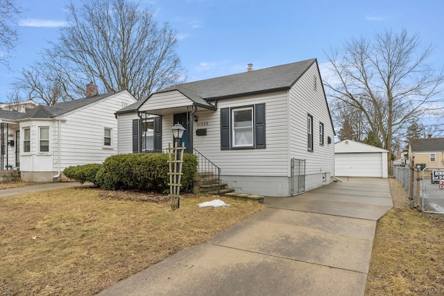 bungalow-style house featuring a detached garage, roof with shingles, a gate, fence, and an outdoor structure