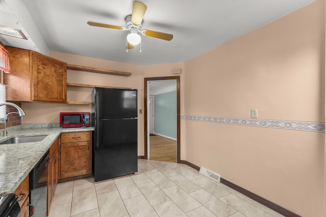 kitchen featuring open shelves, visible vents, brown cabinetry, a sink, and black appliances