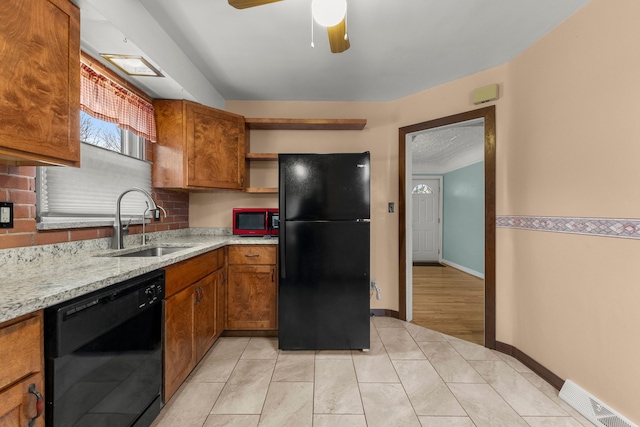 kitchen with visible vents, brown cabinets, black appliances, open shelves, and a sink