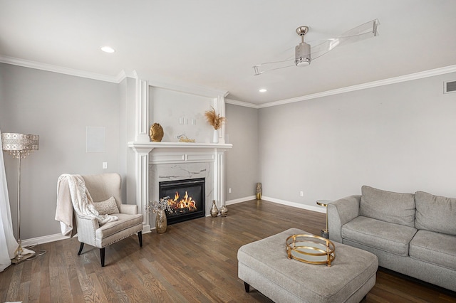 living room featuring visible vents, baseboards, ornamental molding, dark wood-type flooring, and a high end fireplace