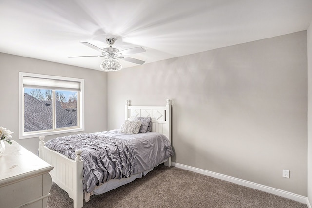 bedroom featuring ceiling fan, carpet flooring, and baseboards