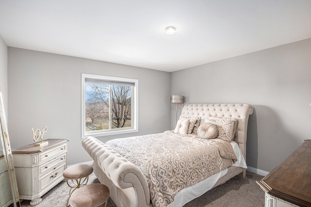 bedroom with baseboards and light colored carpet