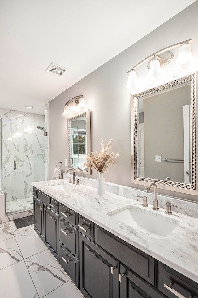 bathroom with marble finish floor, visible vents, a sink, and a marble finish shower