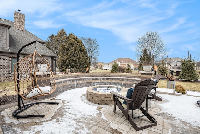 view of patio featuring a residential view and a fire pit