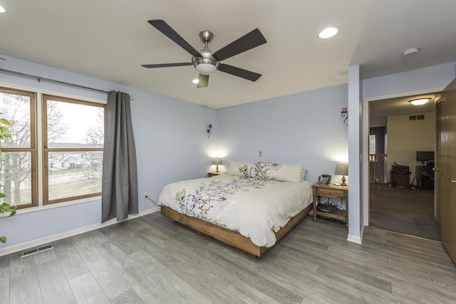 1085 Melrose Ct, Saline, MI 48176 - bedroom with baseboards, wood finished floors, and visible vents