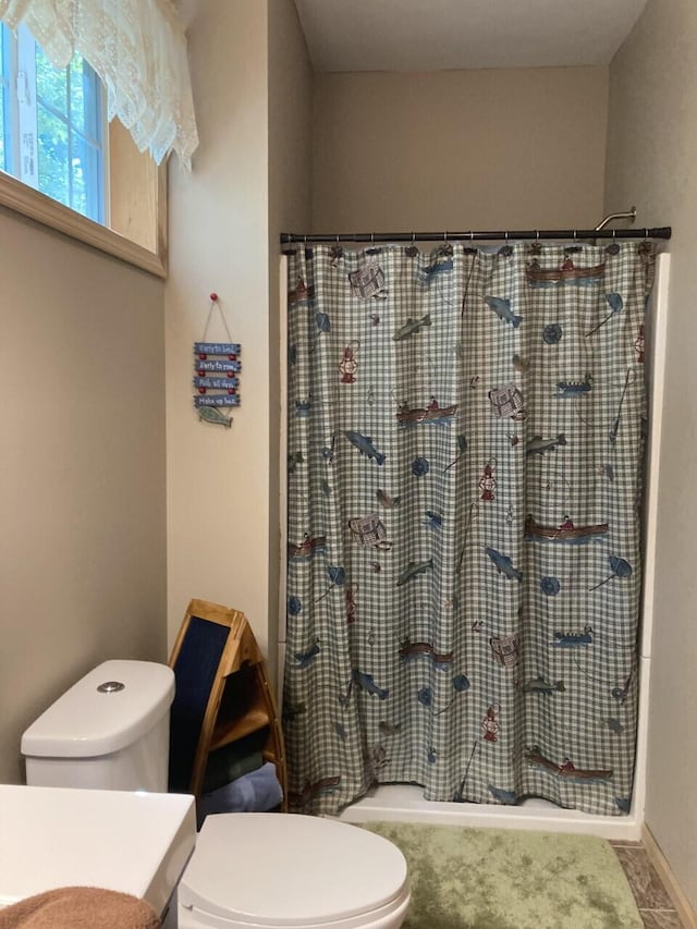 full bathroom with toilet and vanity