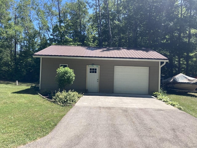 garage with concrete driveway