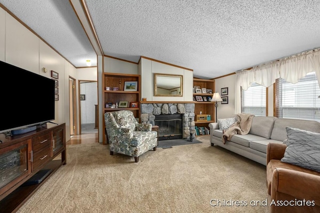 carpeted living room with ornamental molding, lofted ceiling, a stone fireplace, and a textured ceiling