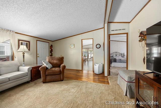 living room with vaulted ceiling, a textured ceiling, carpet flooring, and crown molding