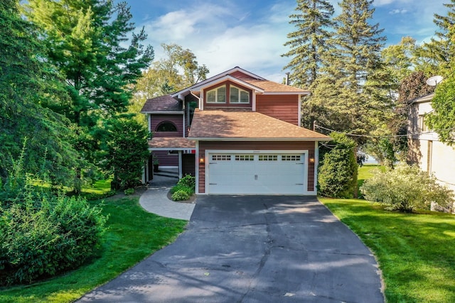 view of front facade with aphalt driveway, an attached garage, a front lawn, and a shingled roof