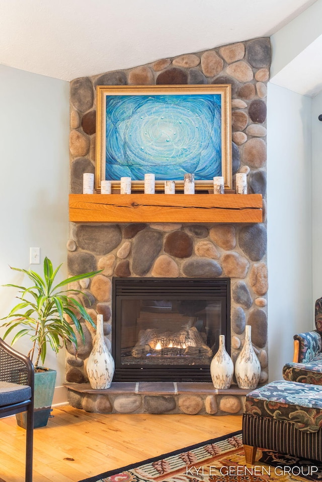 interior details with a fireplace and wood finished floors