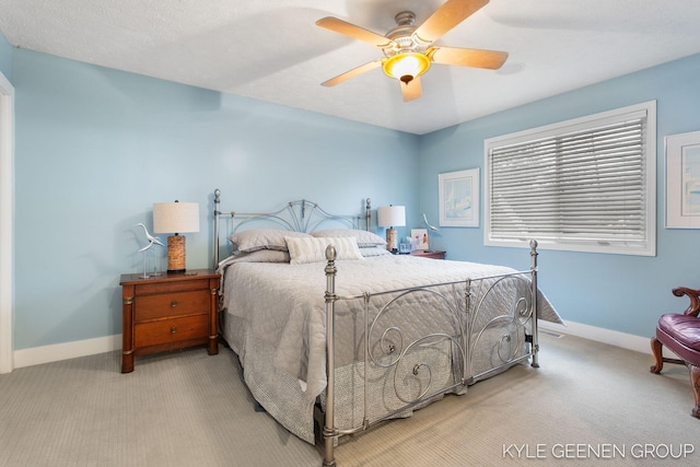 bedroom featuring carpet flooring, a ceiling fan, and baseboards