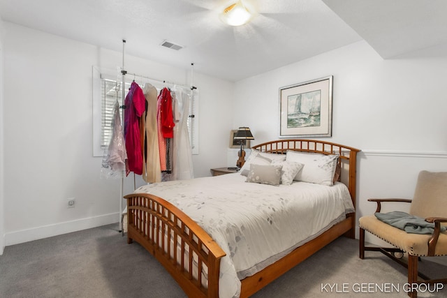 carpeted bedroom featuring visible vents and baseboards