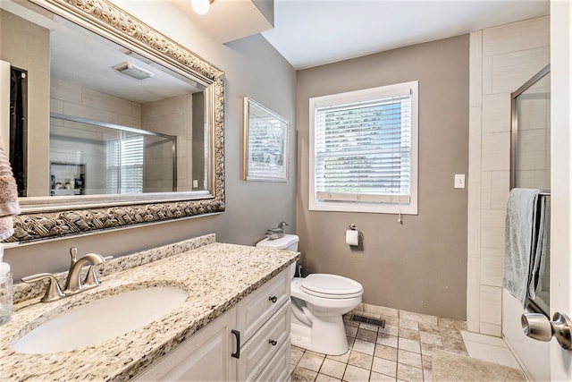 full bath featuring toilet, a stall shower, visible vents, and vanity