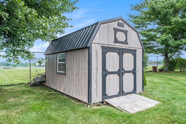 view of shed with fence