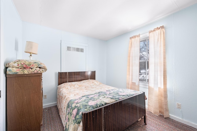 bedroom featuring visible vents and baseboards