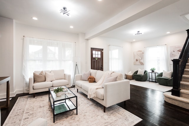 living room featuring a wealth of natural light, wood finished floors, recessed lighting, and stairs