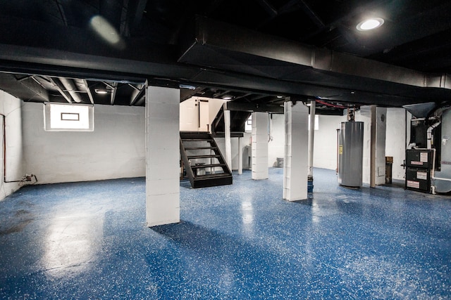 basement with gas water heater, stairway, and heating unit