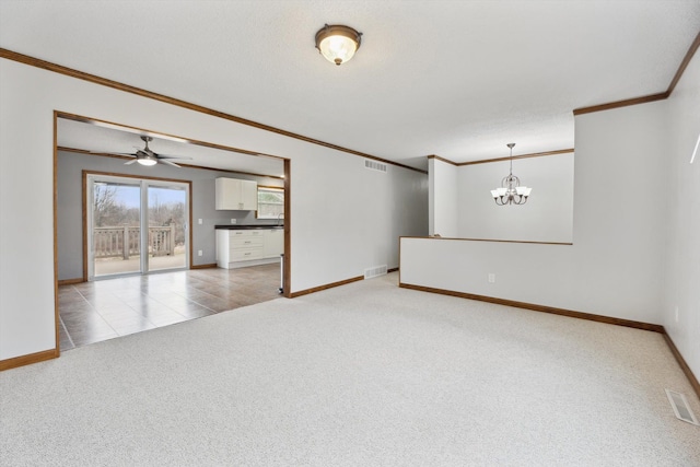 unfurnished living room with ornamental molding, baseboards, visible vents, and light carpet