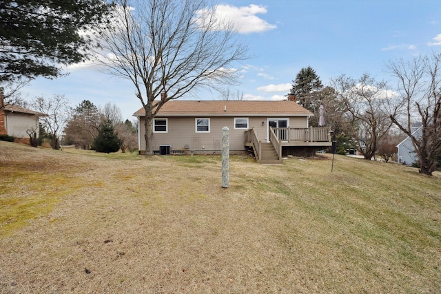 back of house featuring a deck, cooling unit, a lawn, and a chimney