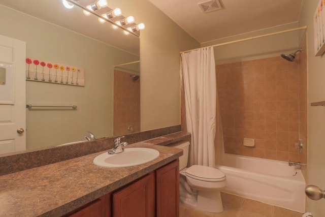 bathroom with visible vents, shower / bath combo with shower curtain, toilet, tile patterned flooring, and vanity