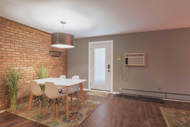 dining area with a wall mounted air conditioner, a baseboard heating unit, wood finished floors, brick wall, and baseboards