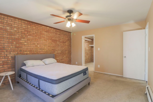 bedroom featuring brick wall, a baseboard heating unit, baseboards, light colored carpet, and a ceiling fan