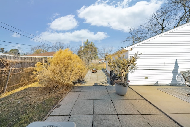 view of patio featuring fence