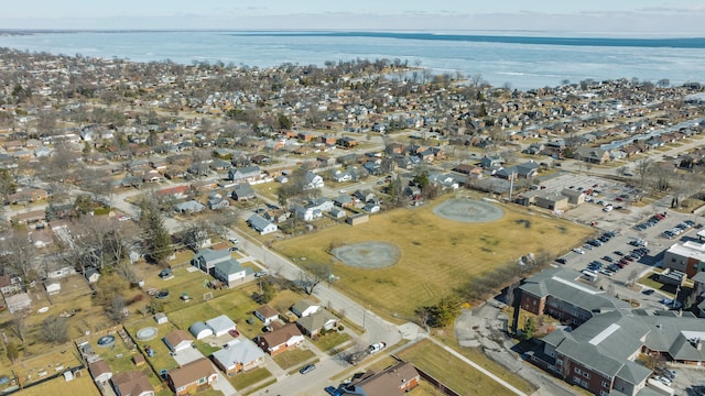 bird's eye view featuring a residential view and a water view