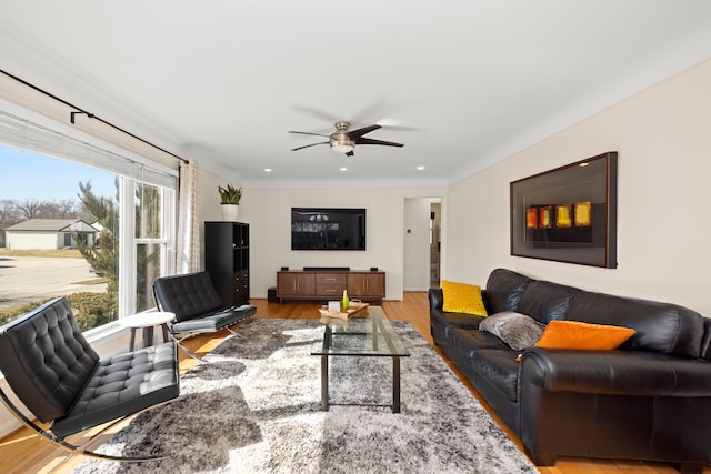 living area with wood finished floors, a ceiling fan, and recessed lighting