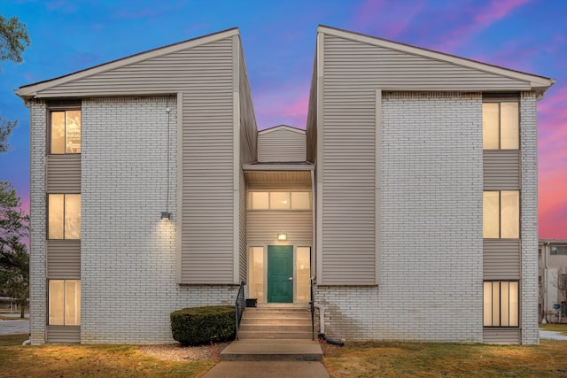 contemporary house with brick siding