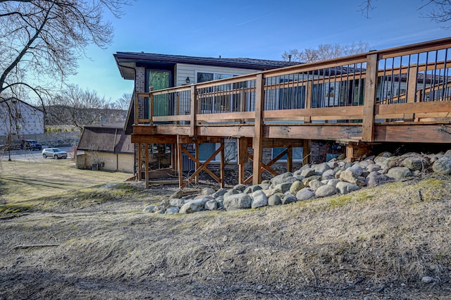 back of property with a wooden deck