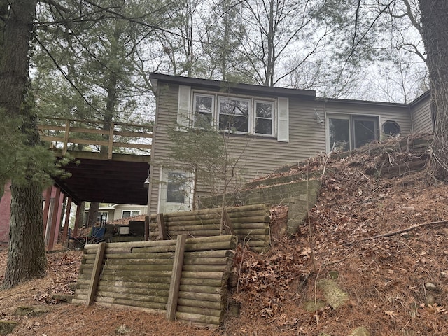 view of home's exterior featuring a wooden deck